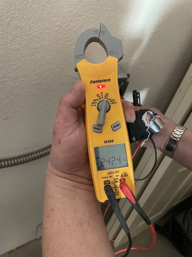 Voltage testing with clamp meter during Outlet Installation in Wallingford
